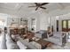 Open-concept living room connected to the kitchen, featuring neutral tones and a fireplace at 11000 Strike The Gold Ln, Waxhaw, NC 28173