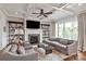 Spacious living room with coffered ceilings, fireplace, and large windows for natural light at 11000 Strike The Gold Ln, Waxhaw, NC 28173
