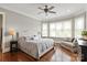 Bright and spacious main bedroom featuring hardwood floors, ample natural light, and a cozy sitting area at 11000 Strike The Gold Ln, Waxhaw, NC 28173