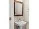 Small bathroom with a mirror above the white sink at 111 Tilton Dr, Mooresville, NC 28115