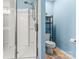 Bathroom featuring a glass shower, a toilet, and shelving at 111 Tilton Dr, Mooresville, NC 28115