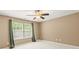 A clean, bright bedroom with soft carpeting, natural light, and simple design elements for relaxation at 111 Tilton Dr, Mooresville, NC 28115