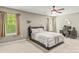 Bedroom with a ceiling fan, two windows, and neutral decor at 111 Tilton Dr, Mooresville, NC 28115