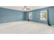 Bedroom with two windows, ceiling fan, and hardwood floors at 111 Tilton Dr, Mooresville, NC 28115