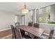Cozy dining area with a wooden table and views of the living room at 111 Tilton Dr, Mooresville, NC 28115