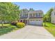 Charming two-story home with well-maintained landscaping and a two-car garage at 111 Tilton Dr, Mooresville, NC 28115