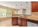 Modern kitchen with granite countertops, tile backsplash, and stainless steel appliances at 111 Tilton Dr, Mooresville, NC 28115