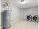 Laundry room featuring a hot water heater, washer, and dryer at 111 Tilton Dr, Mooresville, NC 28115