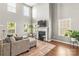 Elegant living room with tall ceilings, fireplace, and large windows at 111 Tilton Dr, Mooresville, NC 28115