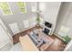Bright, open living room with high ceilings, fireplace, and hardwood floors at 111 Tilton Dr, Mooresville, NC 28115