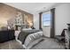 Cozy bedroom featuring stylish accent wall, comfortable bed, and natural light from the window at 1113 Hallman Branch Ln, Lincolnton, NC 28092