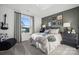 Stylish bedroom featuring decorative wall art, natural light, and comfortable furnishings at 1113 Hallman Branch Ln, Lincolnton, NC 28092