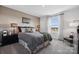 Comfortable bedroom featuring a stylish bed, natural light, and modern decor at 1113 Hallman Branch Ln, Lincolnton, NC 28092