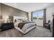 Inviting primary bedroom with a large bed, elegant furnishings, and natural light from the large windows at 1113 Hallman Branch Ln, Lincolnton, NC 28092