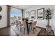 Elegant dining room with contemporary decor, ample seating, and sliding glass doors to a patio at 1113 Hallman Branch Ln, Lincolnton, NC 28092