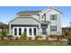 Charming two-story home with gray siding, dark shutters, and a welcoming front entrance with tasteful landscaping at 1113 Hallman Branch Ln, Lincolnton, NC 28092