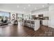 Open-concept living space with a modern kitchen, comfortable living area, and bright dining space at 1113 Hallman Branch Ln, Lincolnton, NC 28092