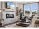 Inviting living room featuring a modern fireplace, large windows, and stylish decor at 1113 Hallman Branch Ln, Lincolnton, NC 28092