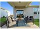 Relaxing covered patio with comfortable seating and outdoor living space at 1113 Hallman Branch Ln, Lincolnton, NC 28092