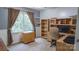 Bright bedroom offers a work desk and a view of nature at 12601 Guardhouse Ct, Charlotte, NC 28262
