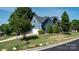 Charming two-story home featuring blue siding and a two car garage with a well-manicured lawn at 12601 Guardhouse Ct, Charlotte, NC 28262