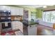 Charming kitchen with granite countertops, stainless steel appliances, and eat-in dining area at 12601 Guardhouse Ct, Charlotte, NC 28262