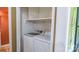 Convenient laundry room featuring modern, front-load Samsung washer and dryer with overhead storage at 12601 Guardhouse Ct, Charlotte, NC 28262