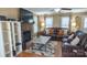 Bright living room with stone fireplace, hardwood floors and neutral decor throughout at 12601 Guardhouse Ct, Charlotte, NC 28262