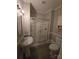 Bathroom featuring a glass-enclosed shower, sink, and toilet at 1415 S York Rd, Gastonia, NC 28052