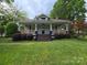 Charming single story home featuring a covered front porch, landscaped yard, and freshly painted siding at 1415 S York Rd, Gastonia, NC 28052