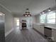 Bright kitchen featuring new flooring, stainless steel appliances, white cabinets, and modern track lighting at 1415 S York Rd, Gastonia, NC 28052
