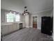 Open kitchen featuring new vinyl flooring, stainless appliances, recessed lights and white cabinets and countertops at 1415 S York Rd, Gastonia, NC 28052