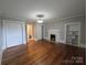 Spacious living room with hardwood floors, fireplace and multiple closets at 1415 S York Rd, Gastonia, NC 28052