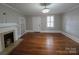 Living room features a fireplace, hardwood floors, and a built-in bookshelf at 1415 S York Rd, Gastonia, NC 28052