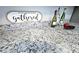 The kitchen countertop is decorated with wine bottles, fruit and a decorative kitchen sign at 169 Freeze Nw Ave, Concord, NC 28025