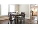 Dining room with table set for four, wood floors and natural light at 169 Freeze Nw Ave, Concord, NC 28025