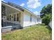 Charming home featuring a welcoming porch with decorative railings and well-maintained lawn at 169 Freeze Nw Ave, Concord, NC 28025
