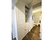 Hallway with storage cabinet leading to bathroom at 169 Freeze Nw Ave, Concord, NC 28025
