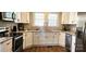 Charming kitchen with granite counters and stainless appliances at 169 Freeze Nw Ave, Concord, NC 28025