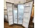 Open refrigerator showing ice maker and adjustable shelves in a well-lit kitchen at 169 Freeze Nw Ave, Concord, NC 28025