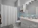 Bathroom featuring retro blue tile, vanity, toilet, and shower-tub combination at 170 8Th Ave, Cramerton, NC 28032