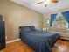 Cozy bedroom features hard wood floors and a neutral color scheme at 170 8Th Ave, Cramerton, NC 28032