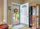Warm entryway featuring decorative glass door and beautiful hardwood floors at 170 8Th Ave, Cramerton, NC 28032