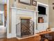 Close up of a fireplace with decorative mantle, offering a cozy and inviting focal point in the room at 170 8Th Ave, Cramerton, NC 28032