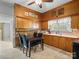 Functional kitchen with retro wood cabinets and a cozy dining area, perfect for Gathering meals at 170 8Th Ave, Cramerton, NC 28032