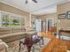 Comfortable living room boasting hardwood floors, neutral colors, and lots of natural light at 170 8Th Ave, Cramerton, NC 28032