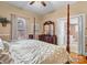 Bright main bedroom features a four poster bed frame, ensuite bathroom, and dresser at 170 8Th Ave, Cramerton, NC 28032