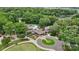 Aerial view showcases the community center, pool, and golf course surrounded by lush trees at 18 Shipmaster Ct, Clover, SC 29710