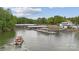 Picturesque aerial view of the waterfront docks, boat, and surrounding natural beauty at 18 Shipmaster Ct, Clover, SC 29710