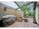 Outdoor space with seating, BBQ grill, and hot tub on back deck with overhead lighting at 18 Shipmaster Ct, Clover, SC 29710